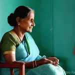 장기 요양 간호 - **Prompt 1: Serene Home Care Moment**
    "A cozy indoor scene featuring an elderly Bengali woman, p...